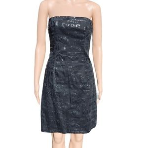 Black strapless mini dress - reads: sexy, kisses; etc. Great for your hot date💋